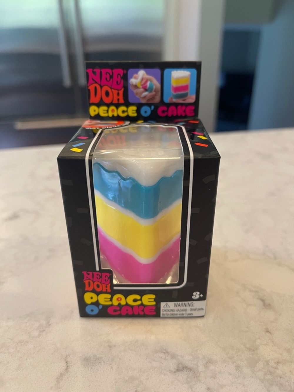 Nee Doh Peace O' Cake Layered Squishy Toy - Blue, Yellow, Pink, White